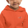 kids-eco-hoodie-burnt-orange-zoomed-in-3-62c3ce40c98a2.jpg